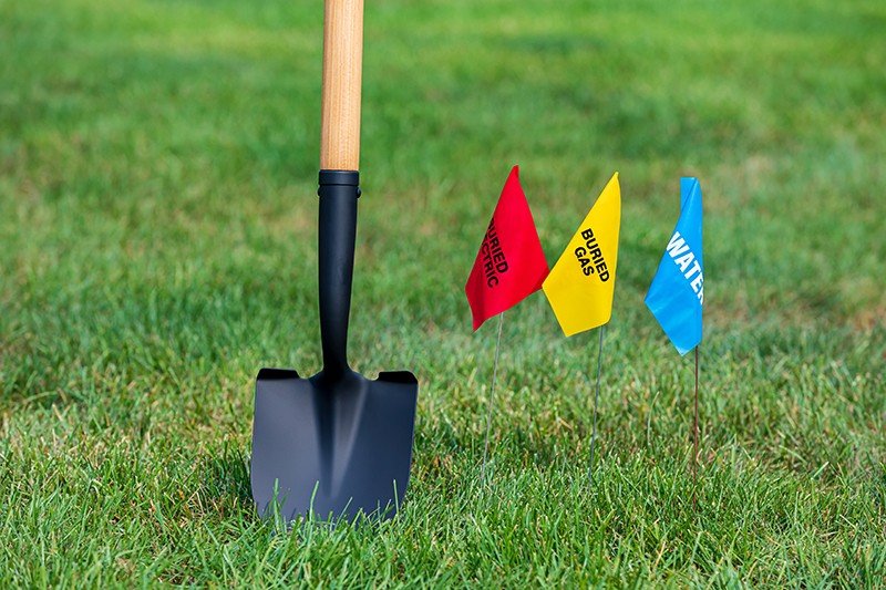 Digging site with utility flags